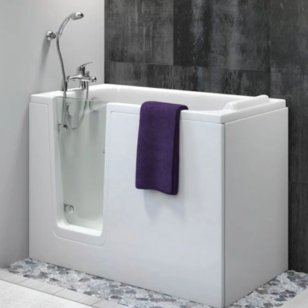 A compact corner walk-in bath with a low glass door