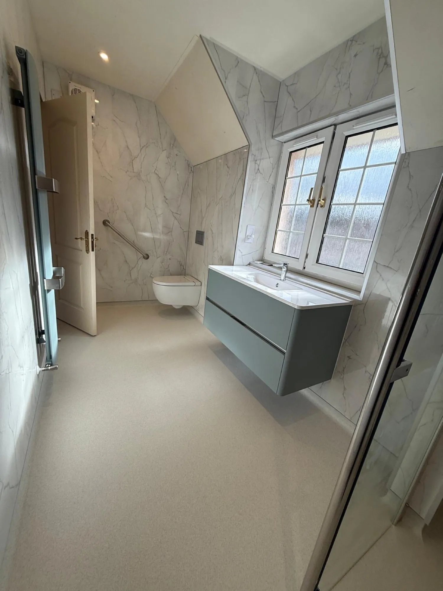 Attic shower room with a sloped ceiling