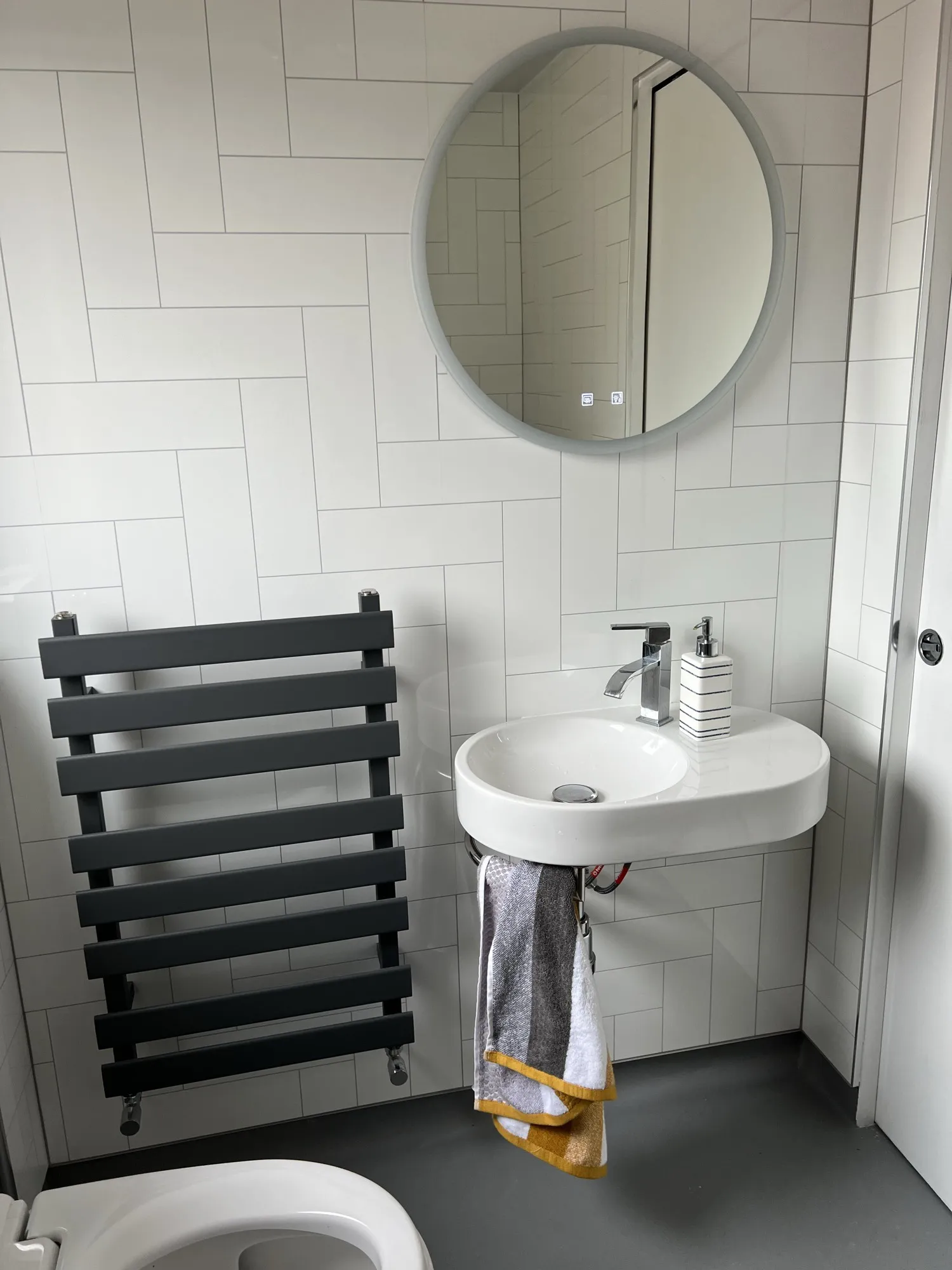 Grey marble-effect walk-in shower with a glass screen