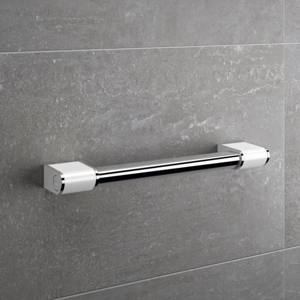 A contemporary chrome grab rail on grey wall panels