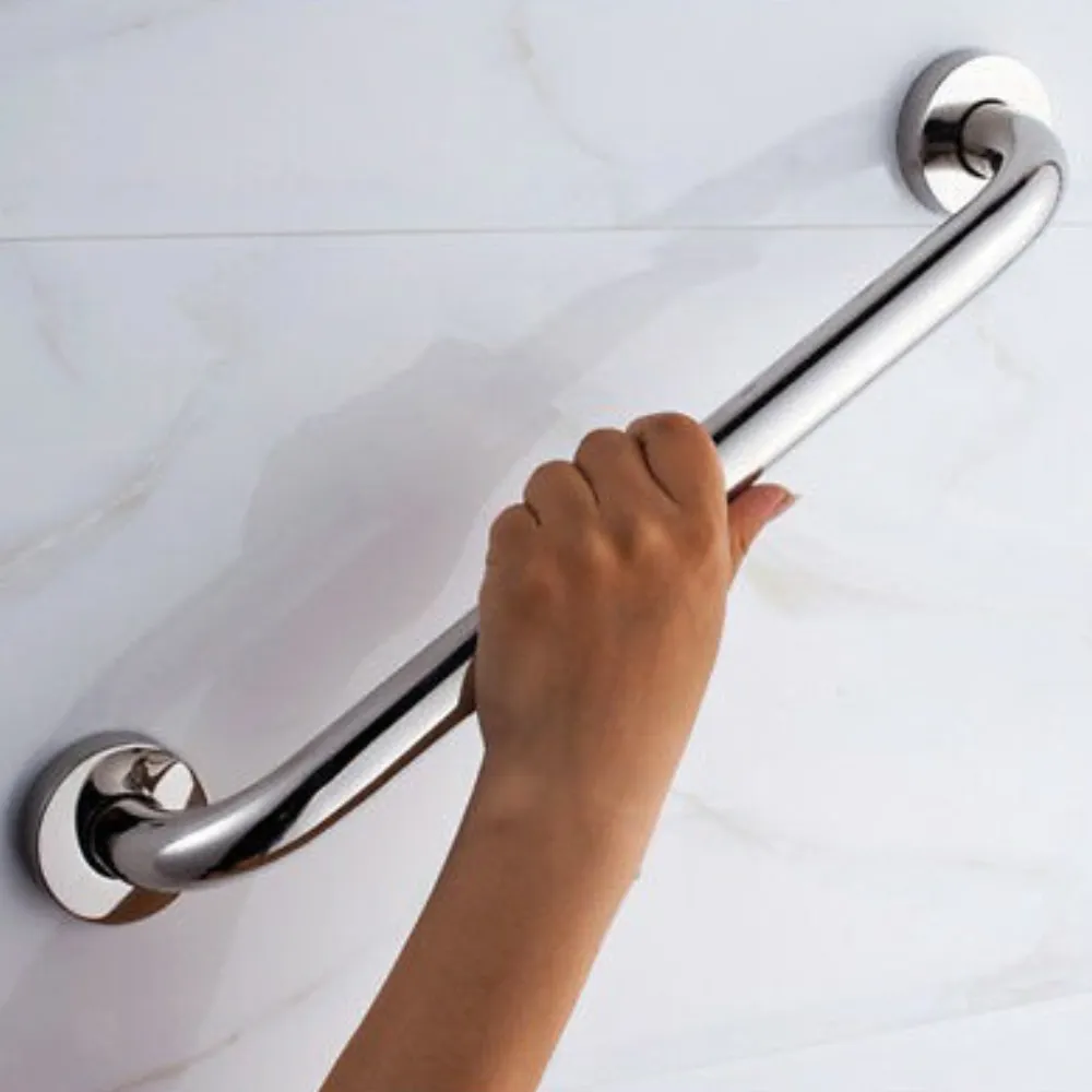 A hand holding a chrome bathroom grab rail