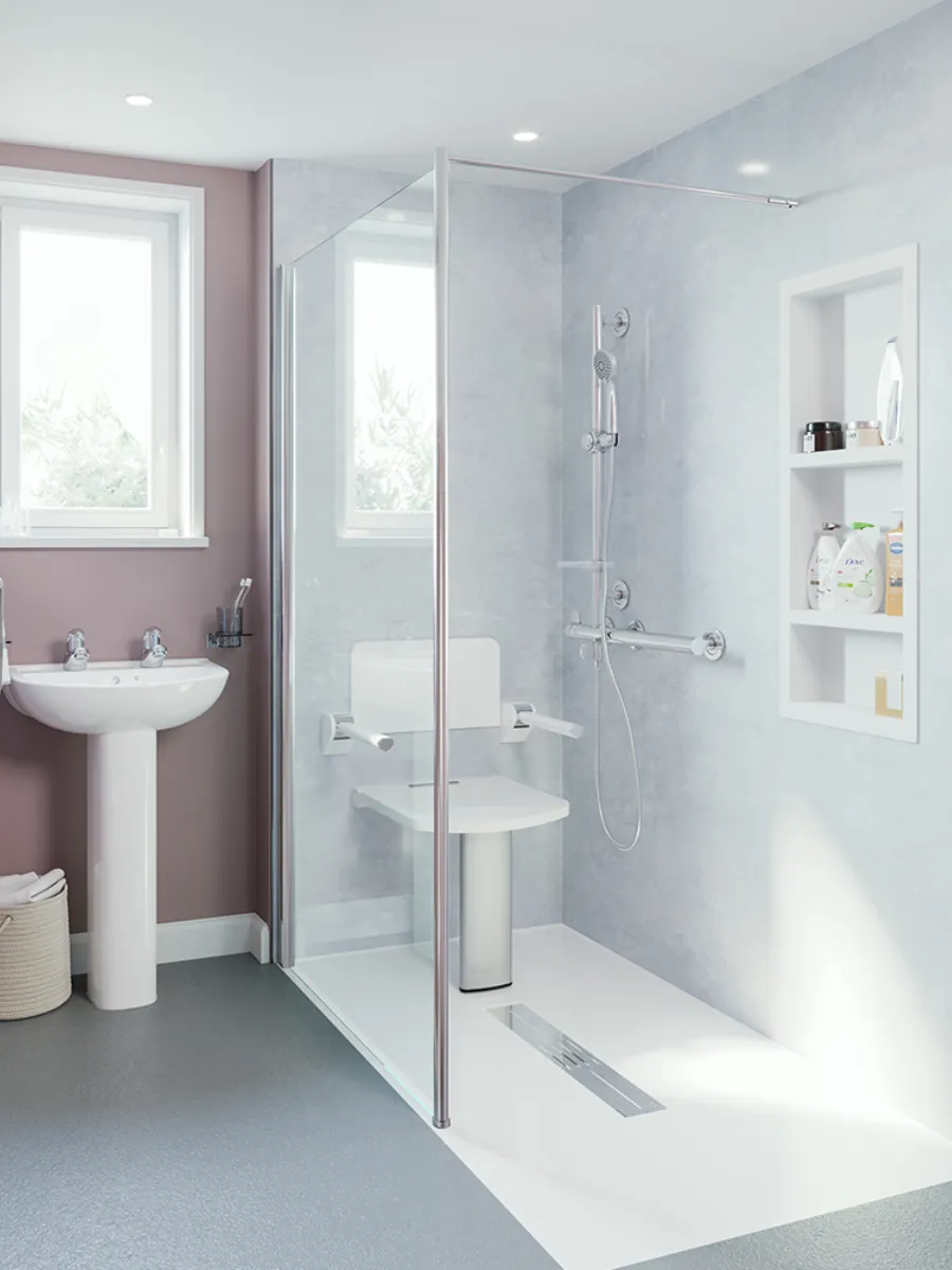 A frameless glass shower screen with a wide entrance and folding seat
