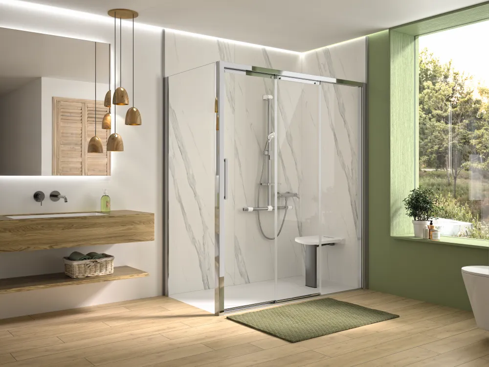 A sliding shower screen in a green and wood bathroom
