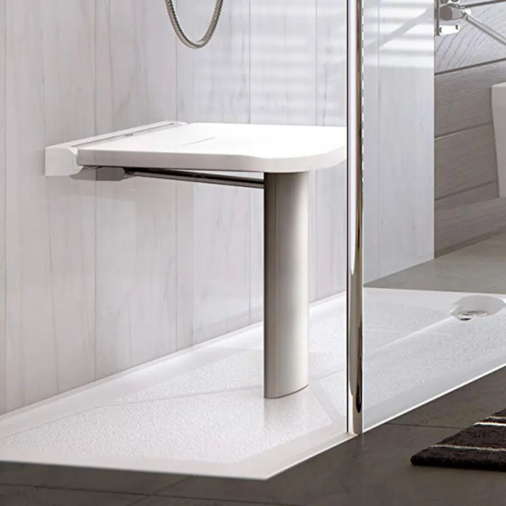 A folding shower seat with a support leg fitted inside a shower