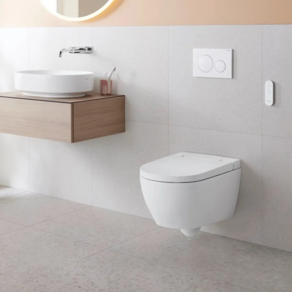 A wall-hung wash-and-dry toilet in a finished bathroom