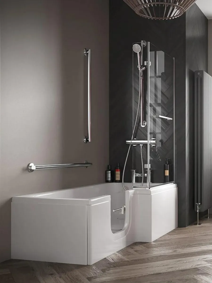 A full-length walk-in bath with a low side door and shower screen